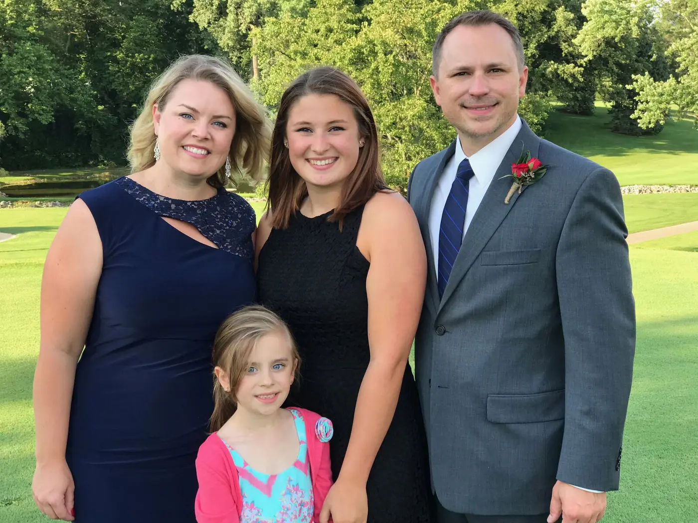 The Vinci family together outdoors: Brian, his wife, and their two daughters