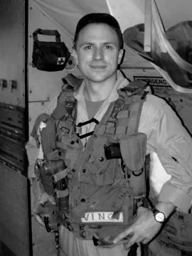 Brian Vinci aboard the aircraft wearing a survival vest with his VINCI name tag visible